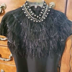 Black shirt with feathers/embellishments